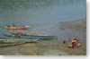 slow boats and speed boats on the Mekong river in Xien Kok (Namtha province)